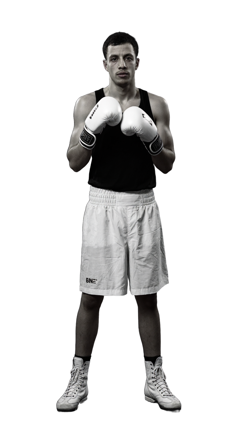 Boxer in white gloves, guard up, on the O15 floor